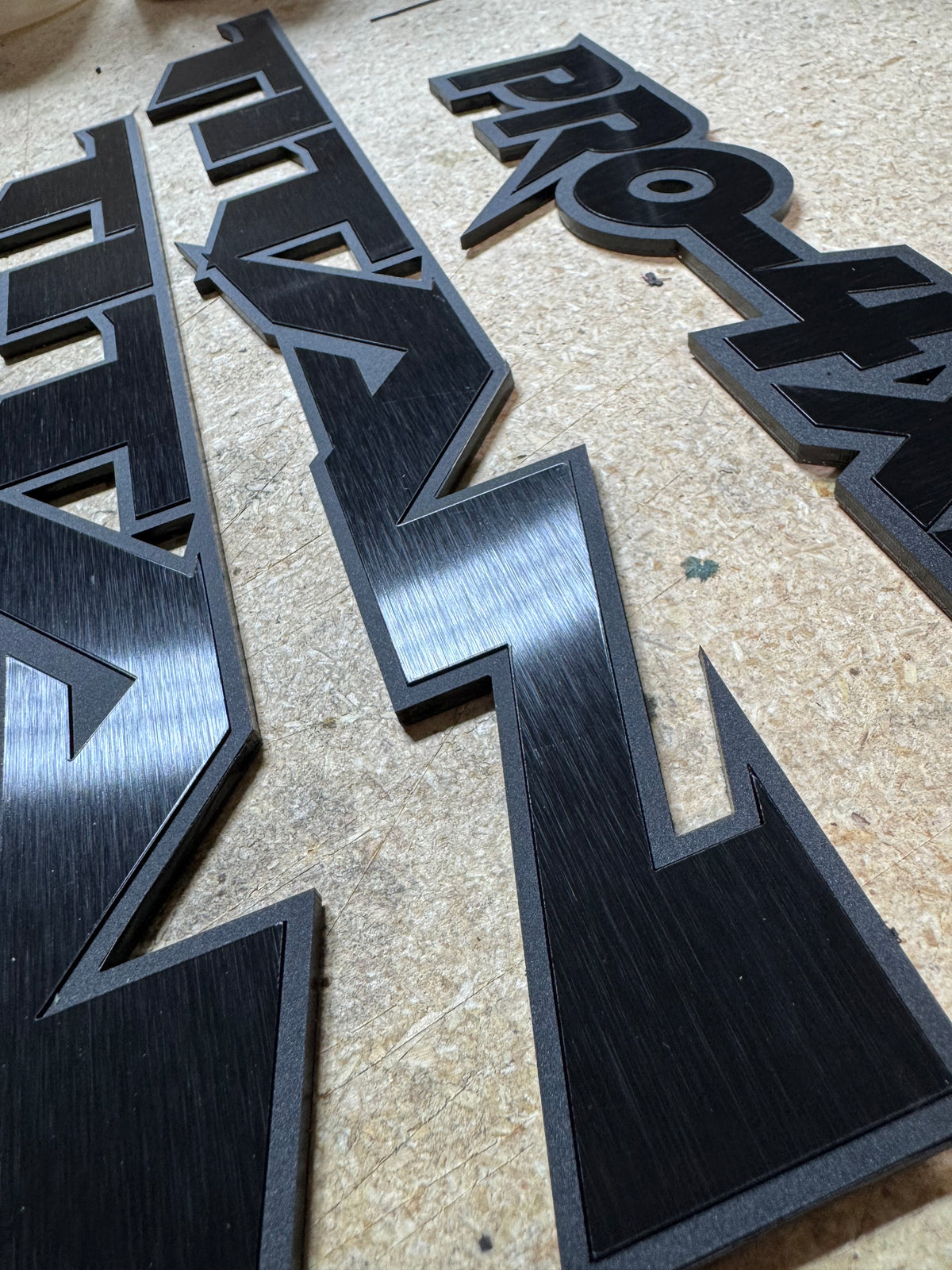 Custom Nissan Titan Emblems – 1/8″ Cast Acrylic with Black Edge & Brushed Black Inlay