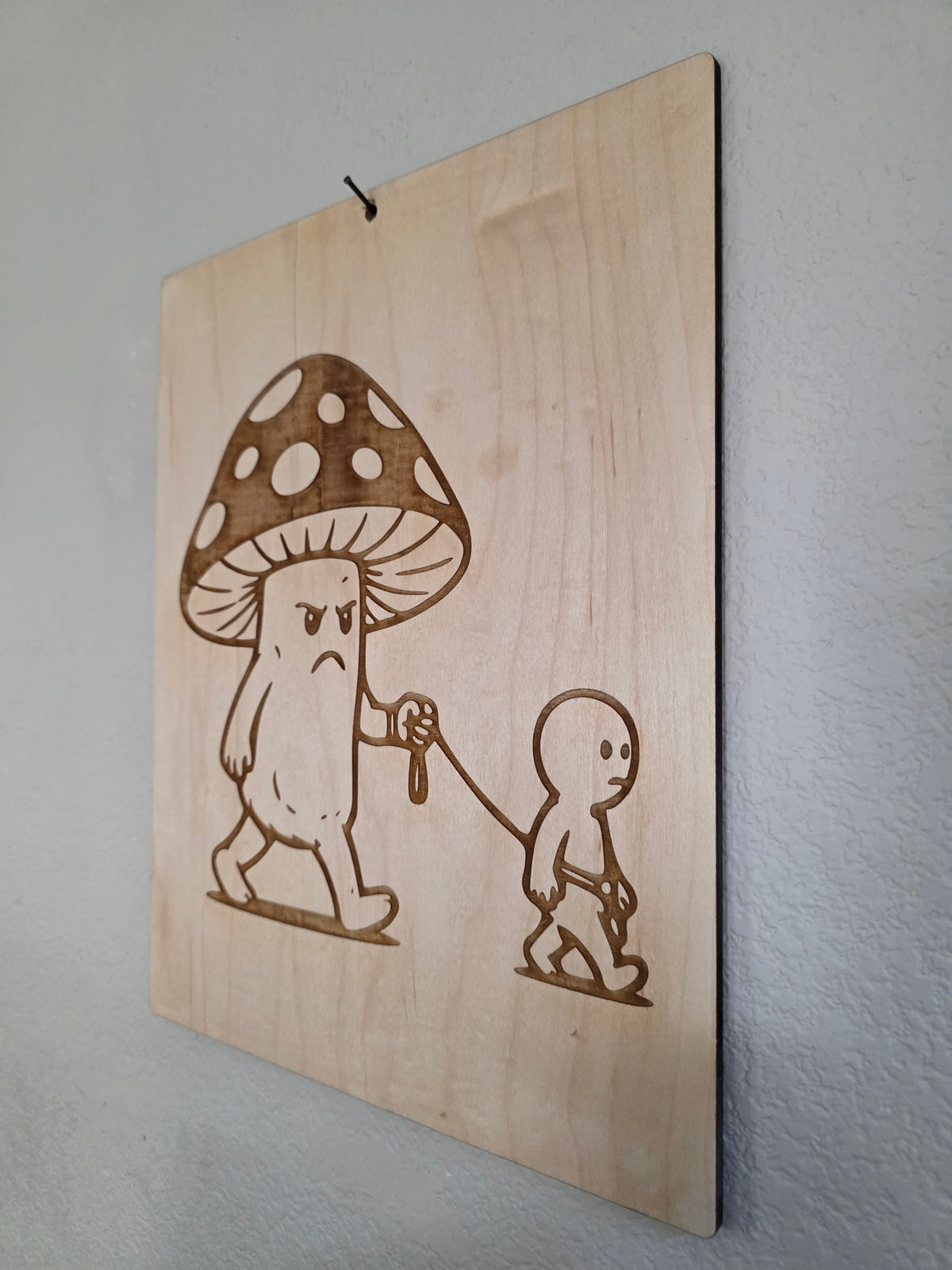 Grumpy Mushroom Walking a Human – 11" x 17" Engraved Maple Wall Art