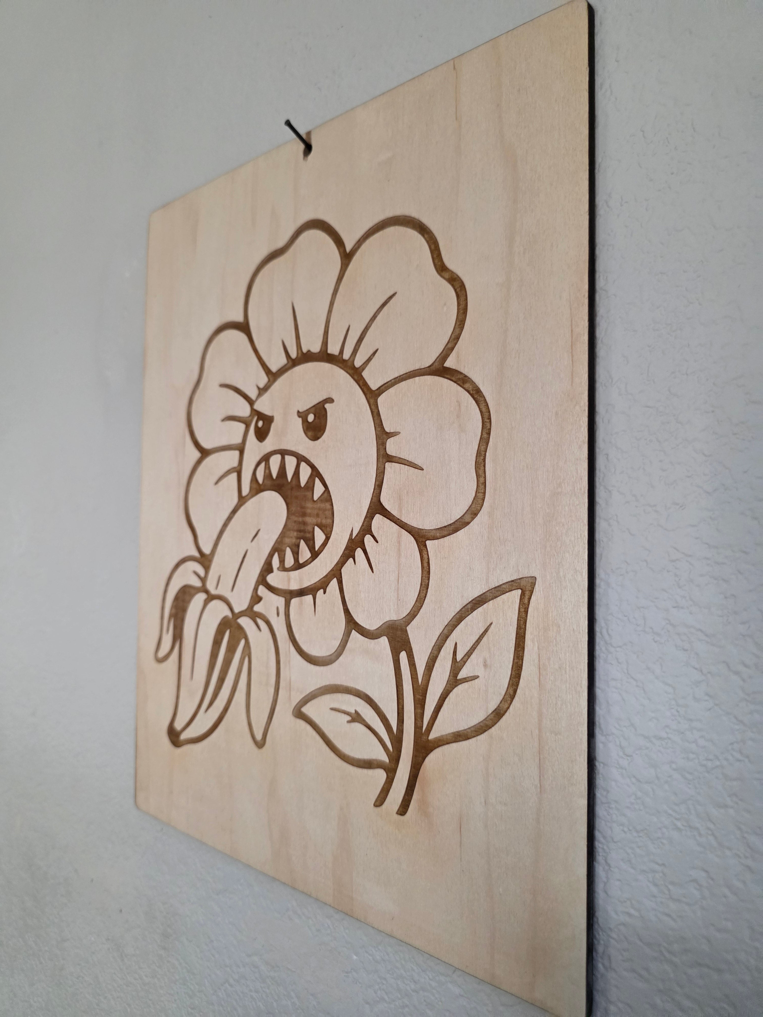 Angry Flower Eating a Banana – 11" x 17" Engraved Maple Wall Art