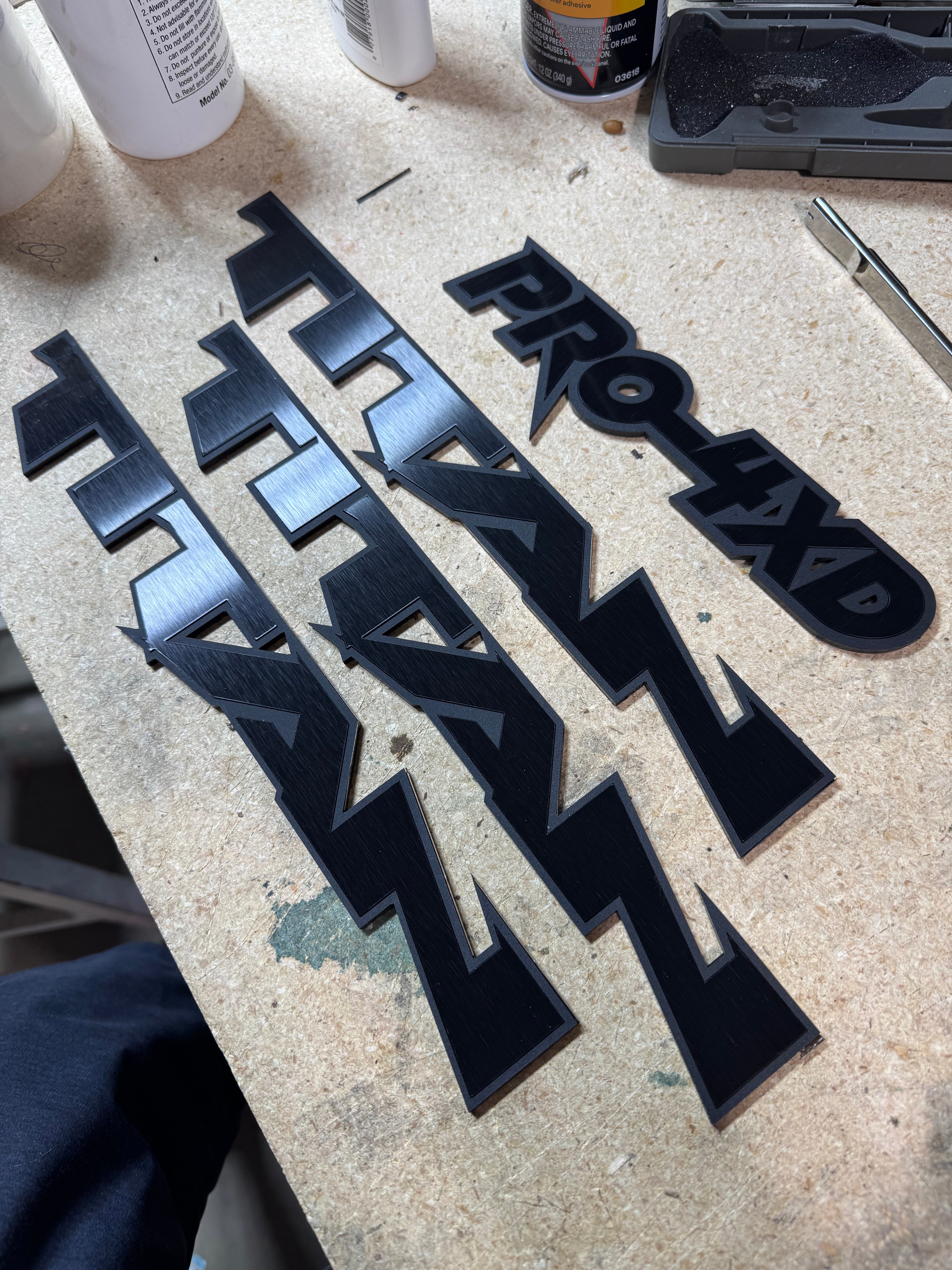Custom Nissan Titan Emblems – 1/8″ Cast Acrylic with Black Edge & Brushed Black Inlay