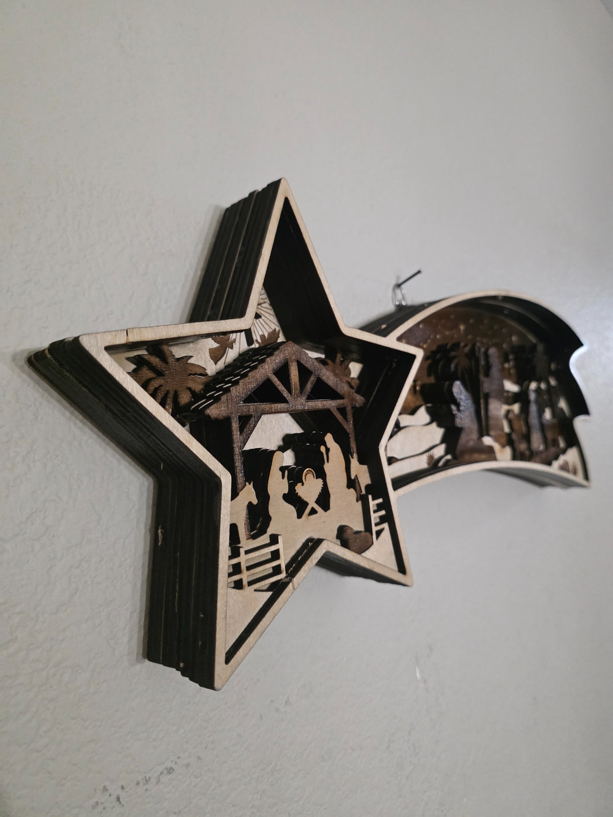 Close angle of shooting star nativity layered wood wall art