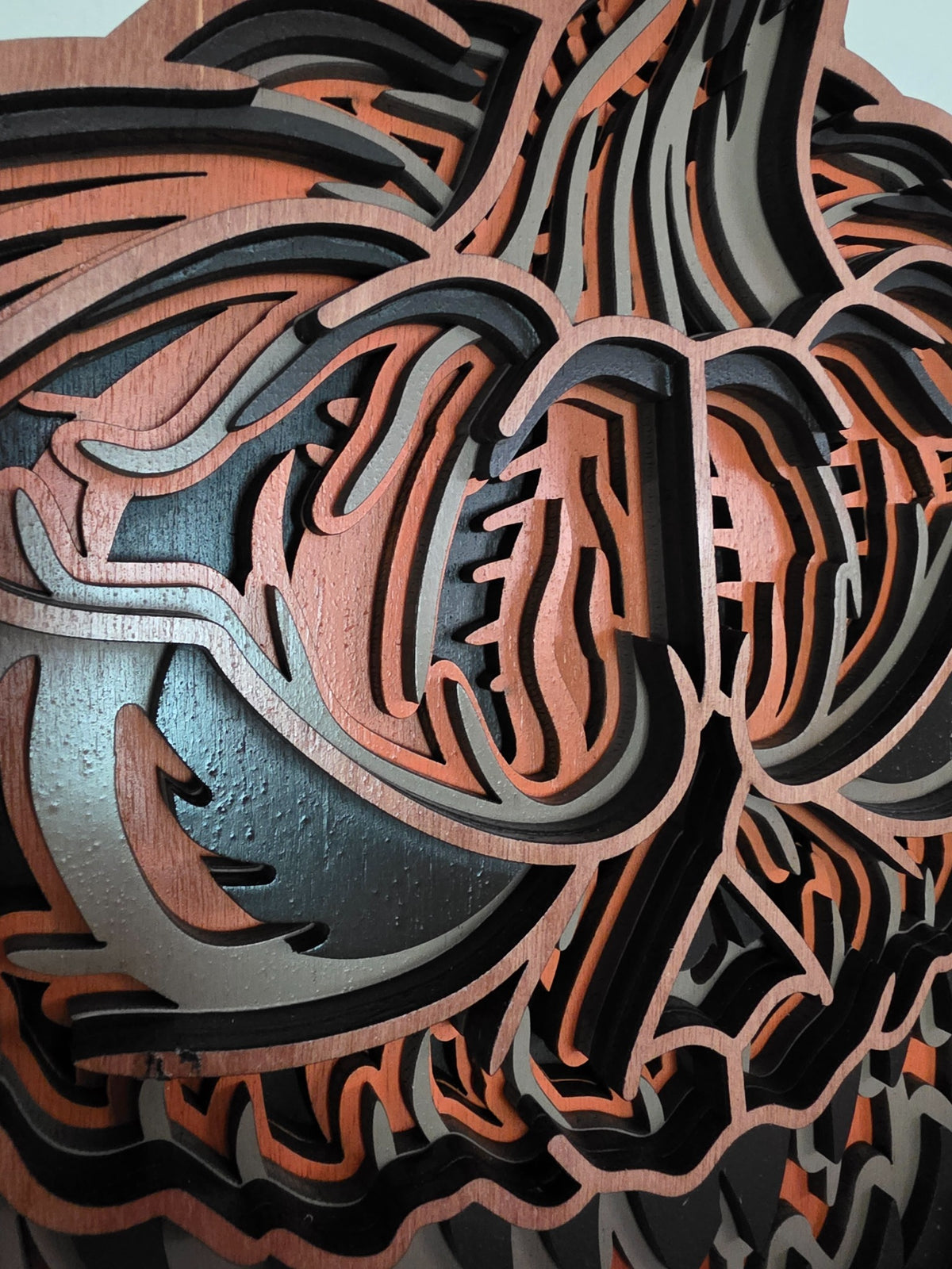 Close-up detail of carved layered pumpkin sections on sinister Halloween wood wall art